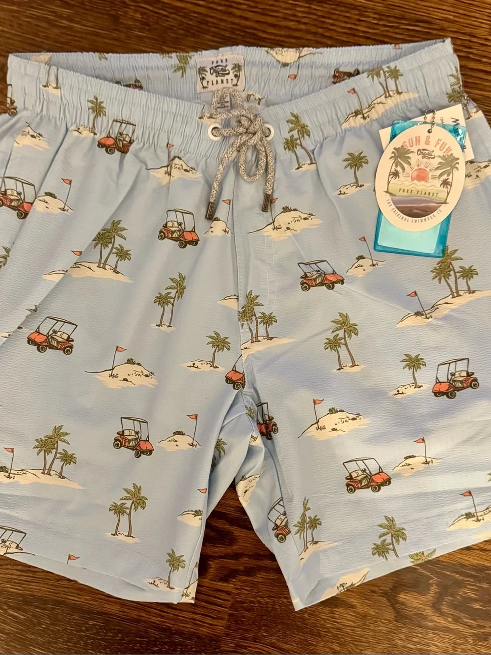 Free Planet Men’s Light Blue Golf Cart & Palm Print Swim Trunks- Medium